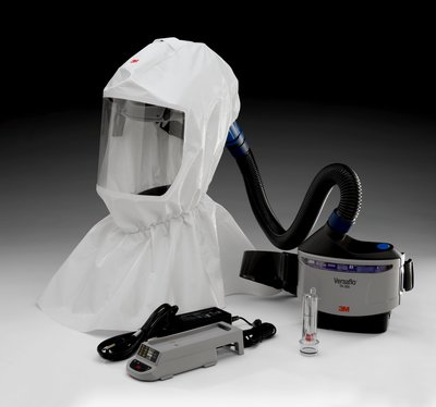 A white protective mask with a tube and a small machine
