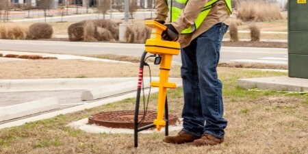 worker using 3M Underground Utility Locator at facility
