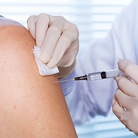 Medical professional administering a vaccine
