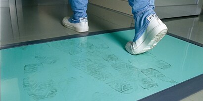 floor mat in hospital to clean shows upon entrance
