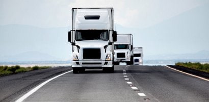 Trucking industry - three white semis