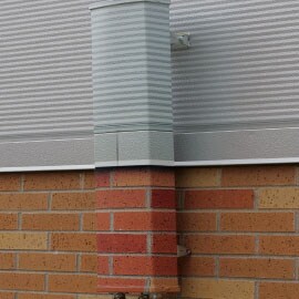 3m print wrap film surrounding a wireless infrastructure on a brick building to blend into the surrounding environment