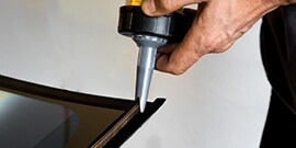 adhesive applied to vehicle window prior to installation