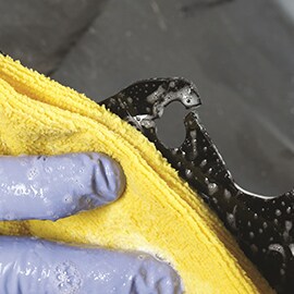 cleaning damaged area on car panel