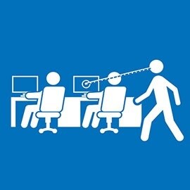 A person looking at the screen of another employee while moving around. 