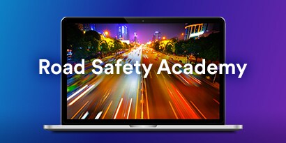 laptop with road safety academy text displayed.
