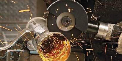 Cutting application using a 3M Silver Cut-off Wheel with sparks flying
