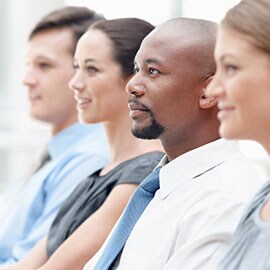 Four students in a classroom setting.