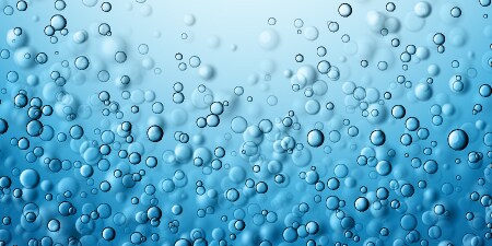 Gas bubbles floating on a blue background
