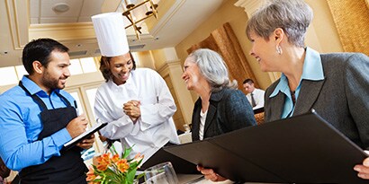 chef interacting with customers
