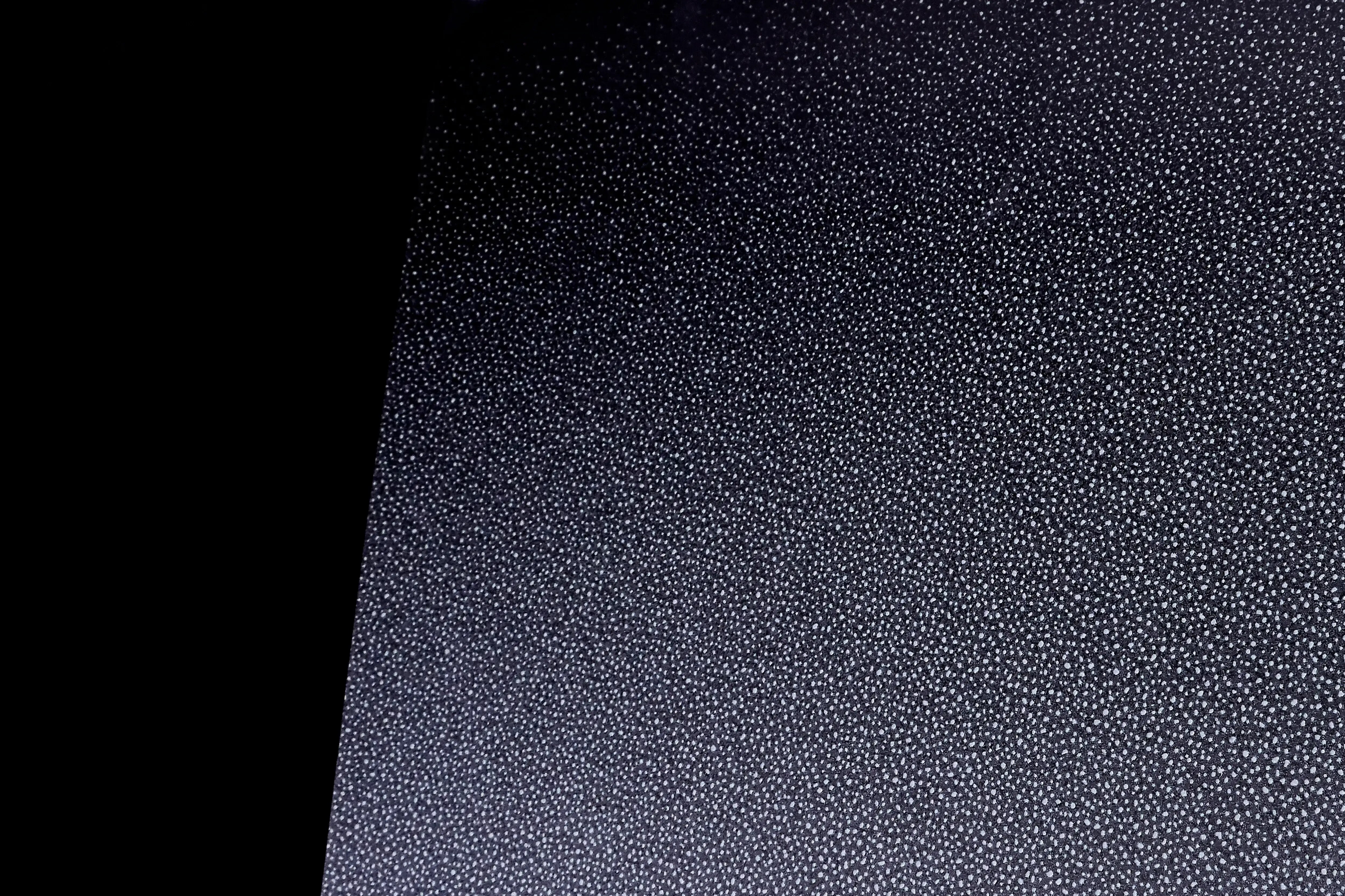 Image chowing close up of FASARA Sand pattern on a black background
