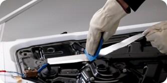 Aluminum foil tape applied in engine compartment to protect parts from heat
