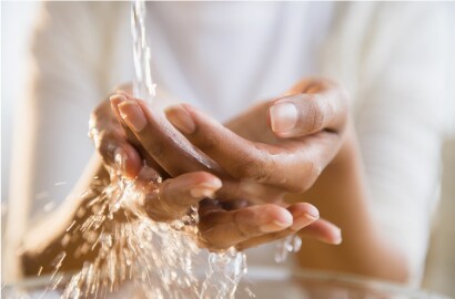 Cupped hands catching quality water
