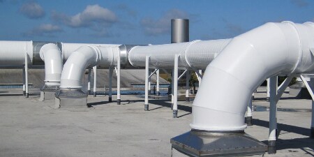 Exterior HVAC ducting with an insulation wrap protecting the underlying insulation from damage
