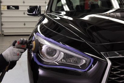 Poly Tape masking around a headlight to allow restoration using a sander.
