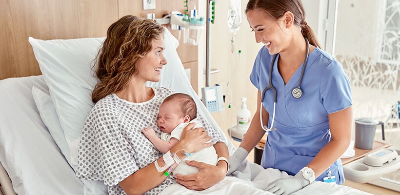 mother and baby with nurse
