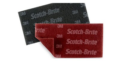 A close-up of a black and red scotch-brite

