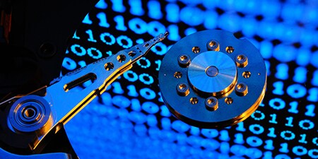 Stylised hard disk drive in manufacturing process
