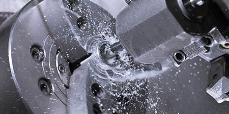 Water being sprayed in the metalworking process
