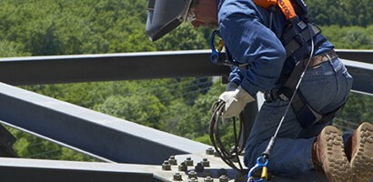 A person wearing a helmet and safety gear

