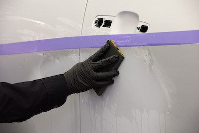 Poly Tape masking a door to allow wet sanding.
