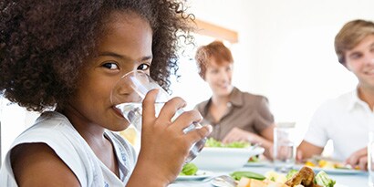Young girl drinking clean water
