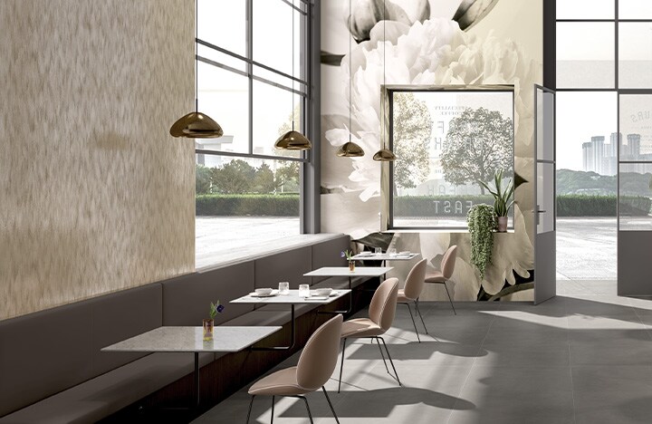 Cafe interior decorated with neutral tones and printed floral mural on graphic film covering walls.