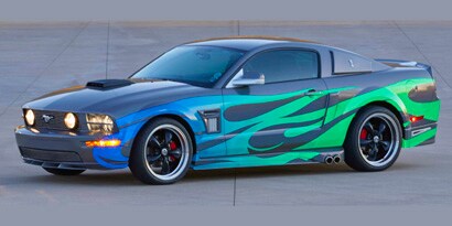 Black race car with green flames wrapped in 3M reflective film.
