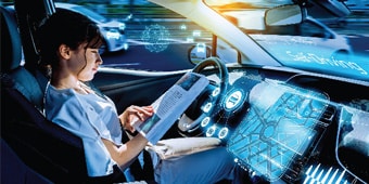 A person in a car using a tablet
