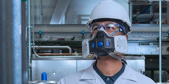 3M Respiratory protecting man in industrial factory
