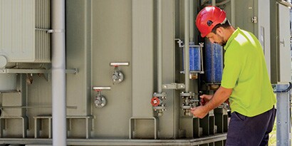 man checking on facility equipment
