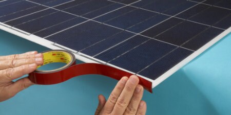 worker applying 3M Solar Tapes for solar module production
