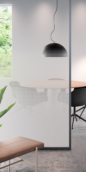 Conference table obscured by a glass panel covered in FASARA Illumina-PR
