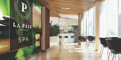 The wall graphic in a spa contributes to a serene yet bright atmosphere.
