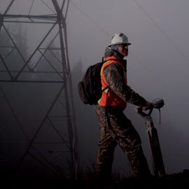 Man with locator in fog