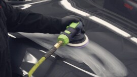 Sander being used on large surface of a car