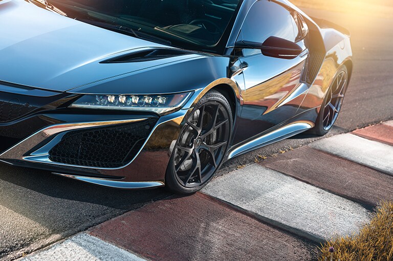 black sports car parked on a road
