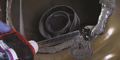 applying adhesive to metal and plastic joint
