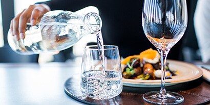 water being poured into a glass
