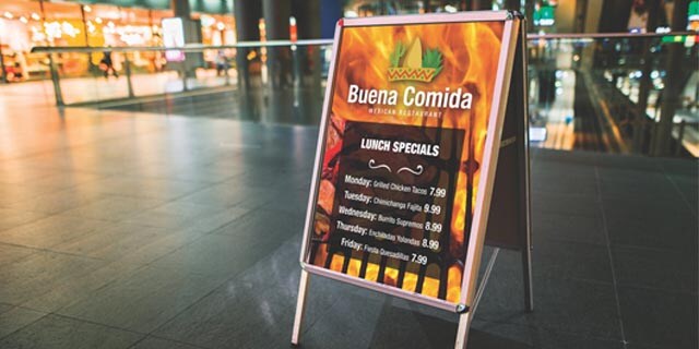 A mexican restaurant's lunch specials sign in front of a fire graphic, wrapped using 3m IJ35C film.