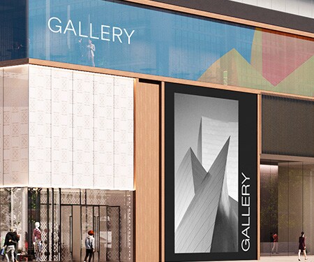 Close up of retail exterior with black and white image printed on opaque graphic and colorful pattern printed on transparent window film.

