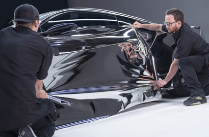two men installing chrome

