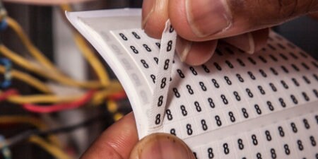 worker placing 3M Wire Markers

