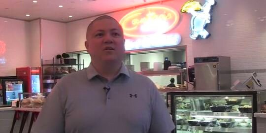 A restaurant manager speaking on the video
