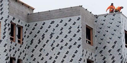 In-progress building covered with 3M air barrier
