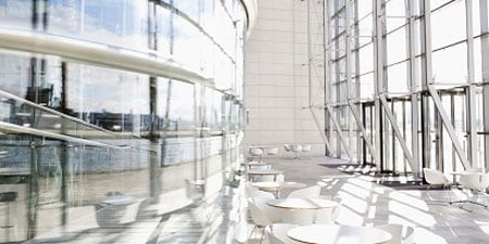 The interior of a large glass building cleaned with 3M Instant Microbe Removing Wipes.
