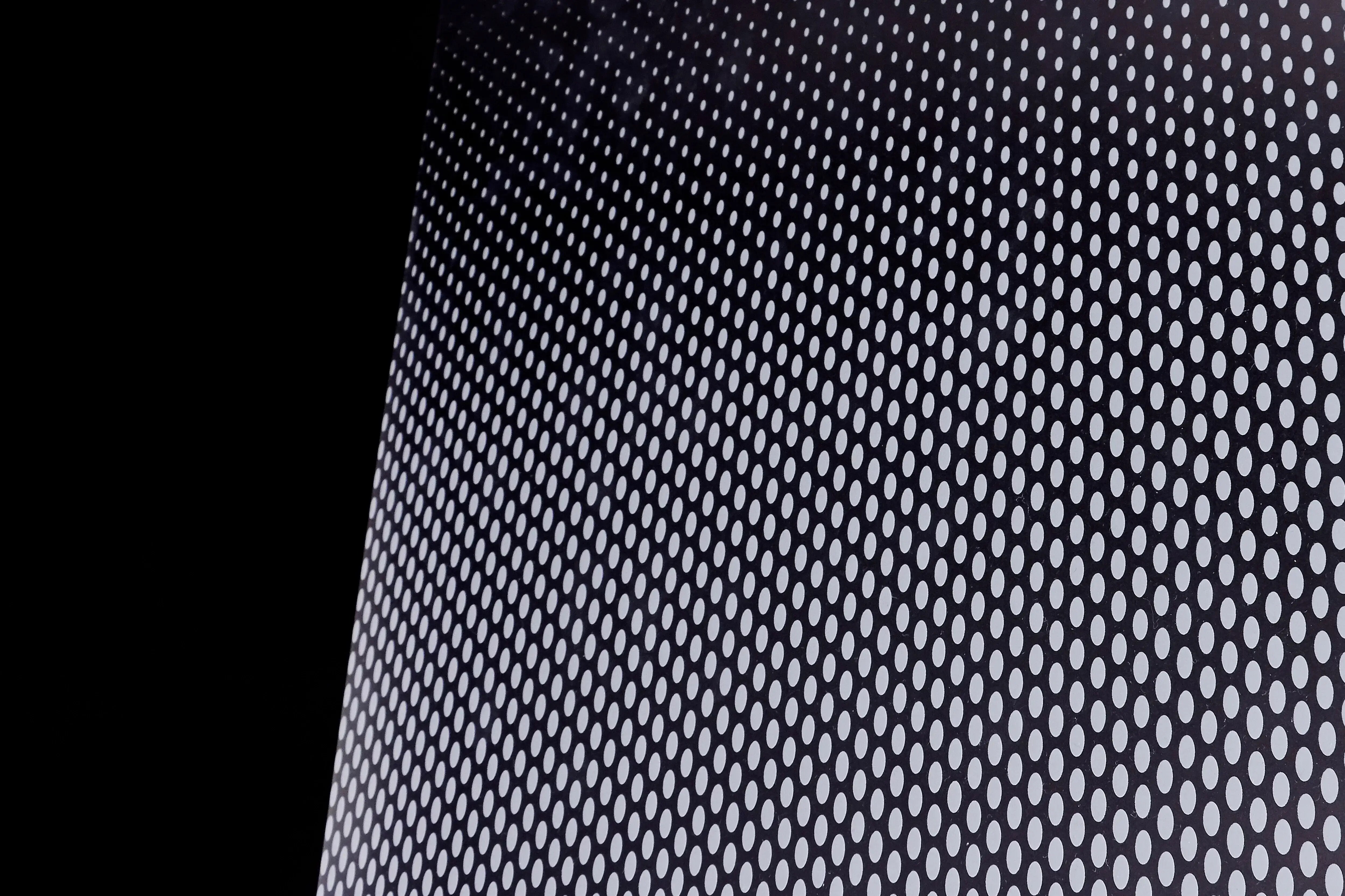 Image chowing close up of FASARA Oval pattern on a black background
