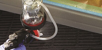 applying antichip coating with accuspray gun and pressure cup
