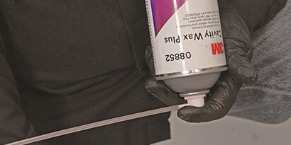spraying cavity wax into closed panel
