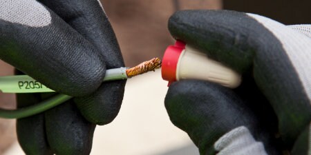 worker capping wires with 3M Wire Connector
